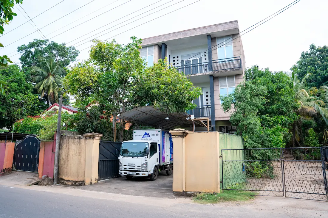 The Hero Mosquito Nets factory building, with the delivery truck parked under the canopy